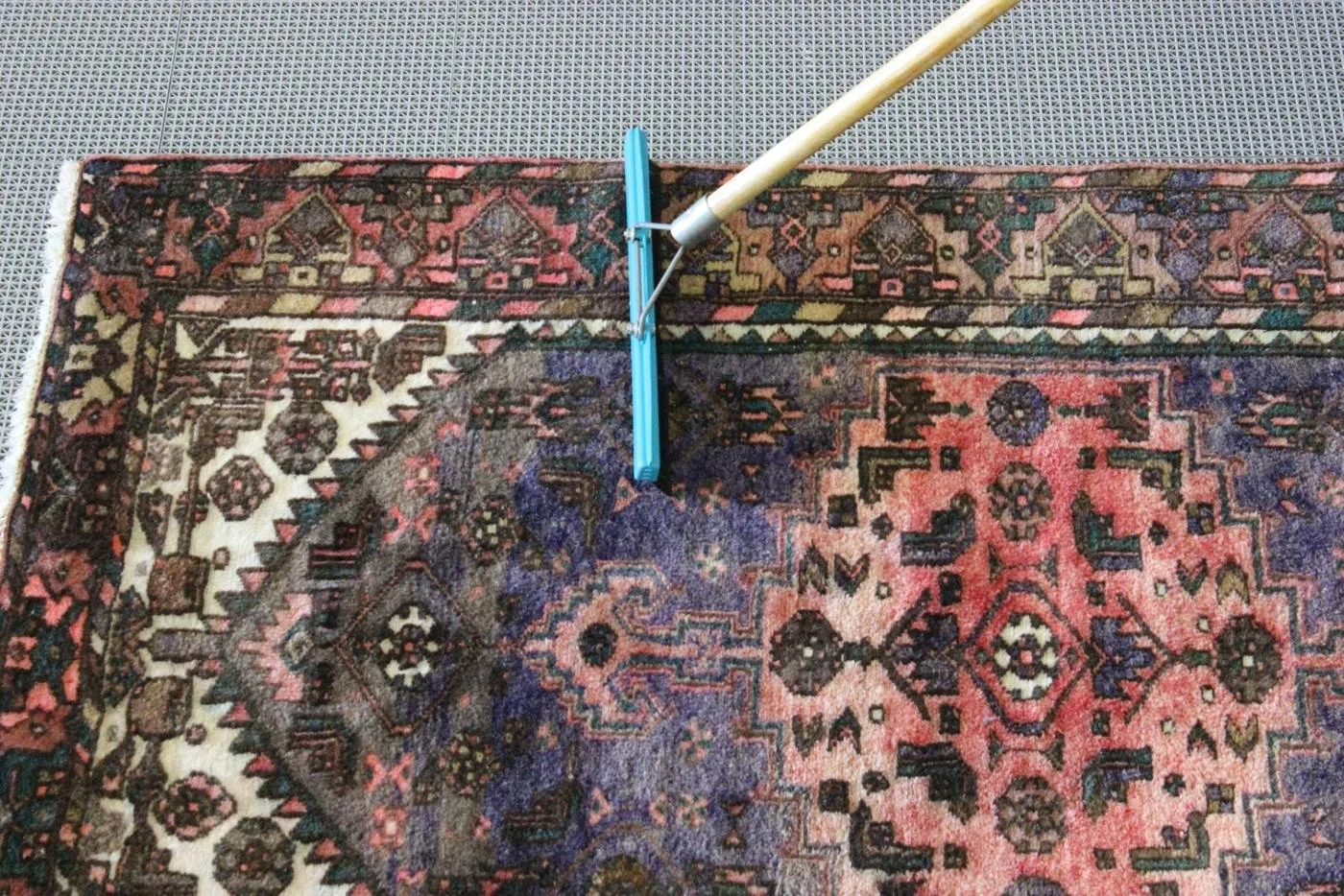 Persian rug flooded and rinsed with clear water on the wash floor